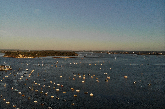 Aerial view of Brownsea Island, Dorset, showing boats moored in the harbor.