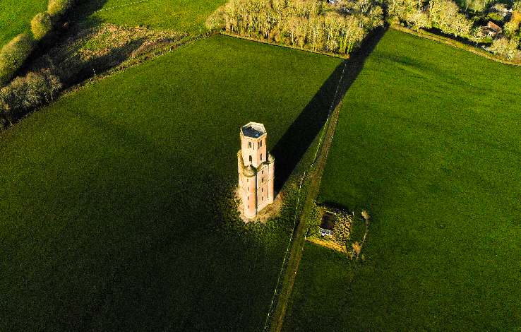 Aerial view of Horton Tower, Dorset, in winter, showing the tower and surrounding fields.