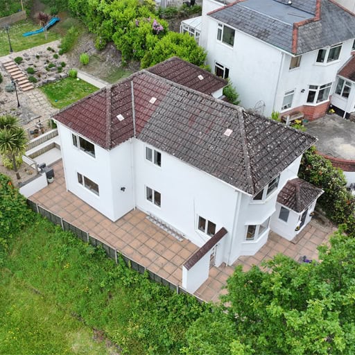 Aerial drone photo of a residential property showing the house, garden, and surrounding area.